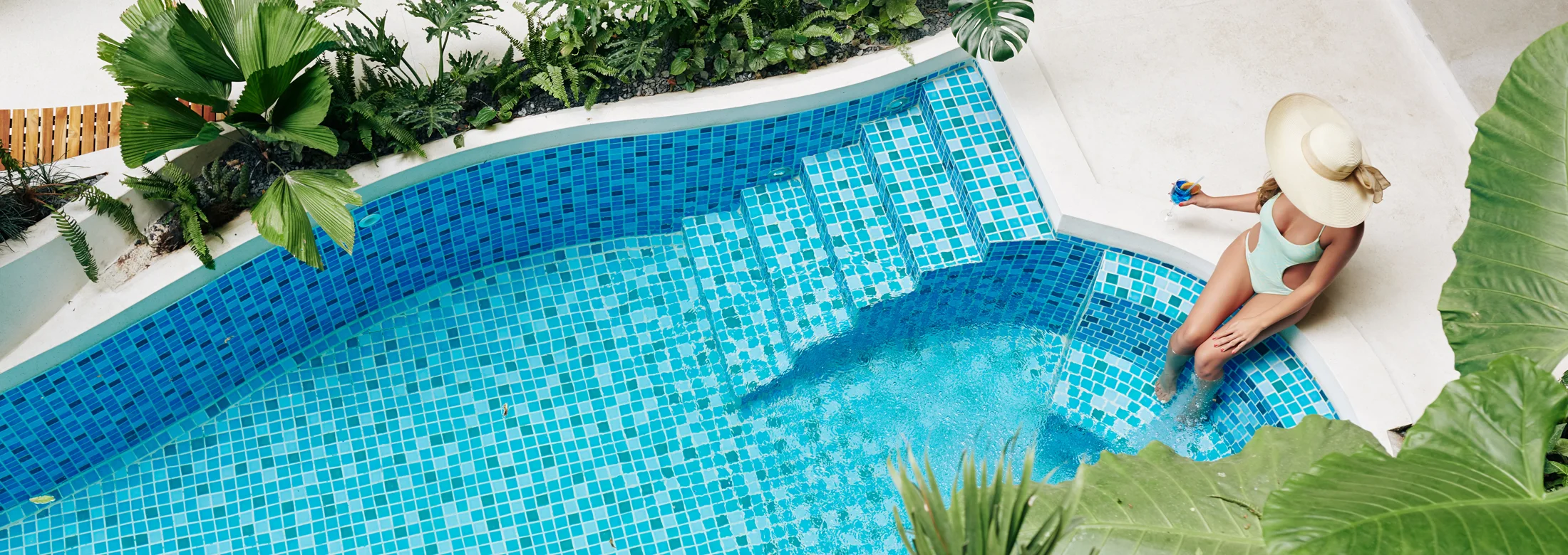woman relaxing near a pool