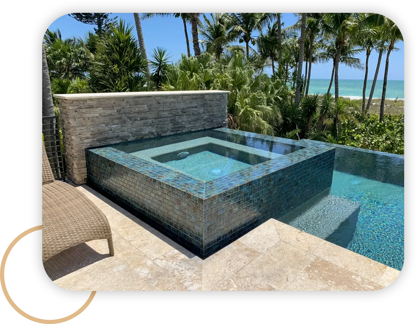 nice pool with custom pool tiles and stone walls